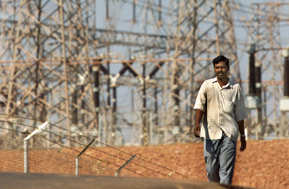 A former employee of Dabhol Power Company walks past an idle plant: Arko Datta